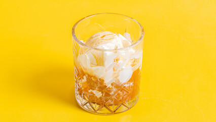 Milkshake glass isolated on yellow

