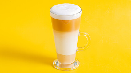 Milkshake glass isolated on yellow
