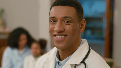 Close up happy confident African American man doctor medical worker looking at camera toothy dental smile professional specialist health face medicine uniform physician home male guy help pediatrician