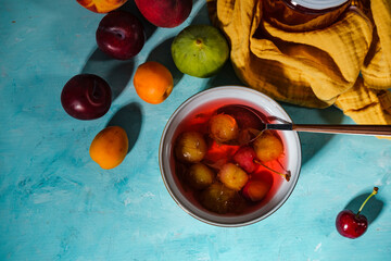 bowl of hosaf a turkish compote dessert of fresh fruits boiled in water with sugar