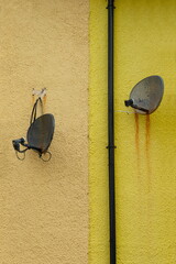 Old satellite dishes on the wall