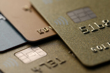 Different plastic credit cards as background, macro view