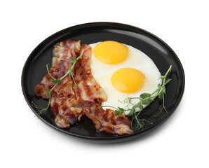 Fried eggs, bacon and microgreens isolated on white