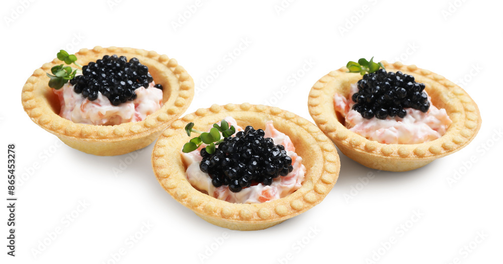 Wall mural Delicious canapes with black caviar isolated on white