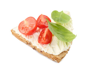Piece of bread with cream cheese, basil leaves and tomato isolated on white