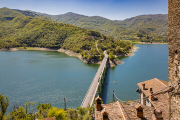 A view of Lake Turano, from the village of Castel di Tora, Rieti, Lazio, Italy. The bridge crossing...