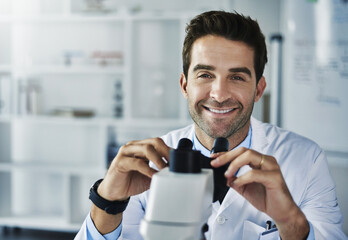 Man, portrait and happy in laboratory with microscope for medical research, specimen analysis and...