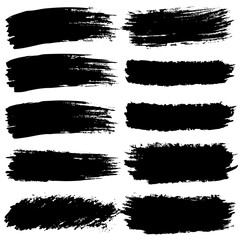 Dark brushstrokes contrast with bright white backdrop on canvas