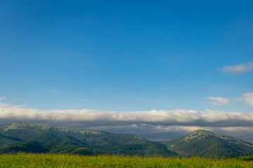 Beautiful landscape in the mountains, sky with clouds.