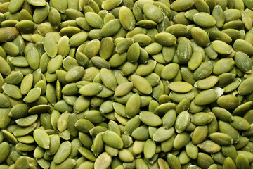 Creative layout made of pumpkin seeds. Flat lay. Food concept. Almond pattern concept.