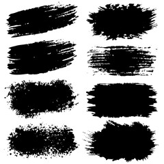 A collection of black brush marks set against a white backdrop