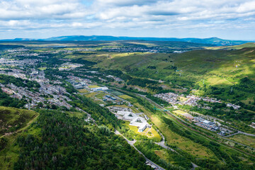 Naklejka premium Aerial view of a South Wales Valleys town surrounded by green hills (Ebbw Vale)