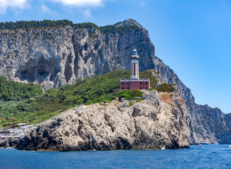 Punta Carena lighthouse on the island of Capri. Red lighthouse on the island of Capri Italy.