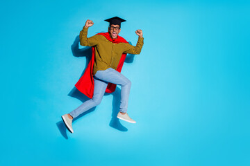 Full size photo of pretty young male running excited graduation wear trendy plaid outfit isolated on blue color background