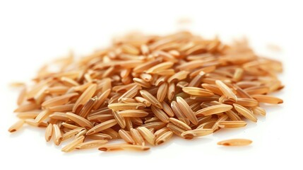 Obraz premium Close-up of a small pile of organic brown rice grains isolated on a white background, showcasing healthy and nutritious whole grain rice.