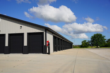 Black and tan storage unit buildings.