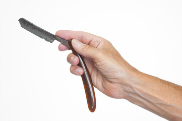 Hand man holding old vintage straight razor on white background