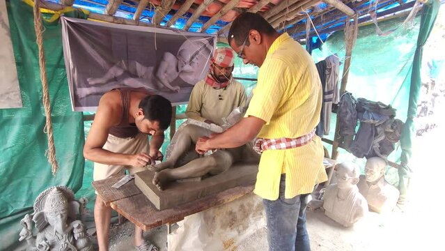 Sculptor Artist Making Plaster Of Paris Mold of a Dying warrior clay Sculpture. This sculpture representing the Trojan king Laomedon, belongs to the pediment of the Aphaia Temple in the small island o
