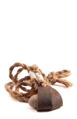 Antique Sling Shot and Stones on a White Background from the Story of David and Goliath in the Bible