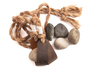 Antique Sling Shot and Stones on a White Background from the Story of David and Goliath in the Bible