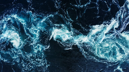 Dramatic sea waves storm from aerial view. Deep dark blue ocean water texture background.