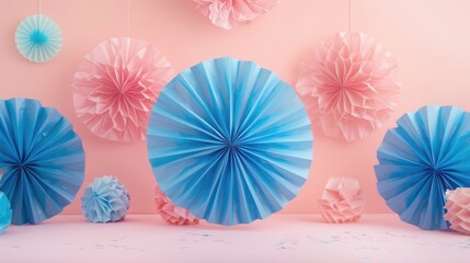 Design space with blue tissue paper fans on a pink backdrop