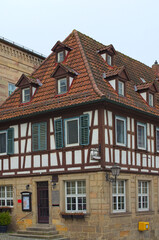 Picturesque street view of ancient house under red tile in the old town of Kronach. Typical architecture in Bavaria, region Upper Franconia, Germany. Travel and tourism concept