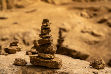 Stack of rocks balancing precariously creating zen atmosphere in nature