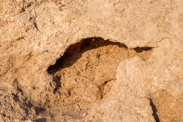 Stone background with a depression in the center, natural sand stones, texture