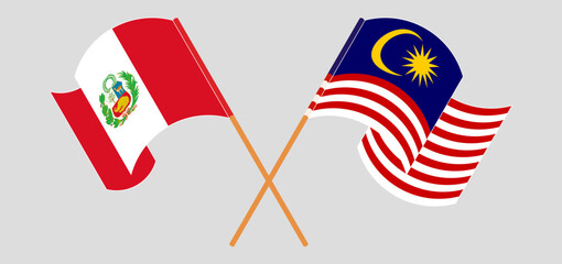 Crossed and waving flags of Peru and Malaysia