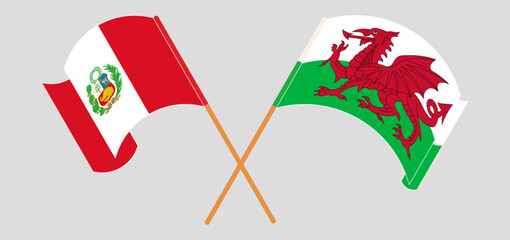 Crossed and waving flags of Peru and Wales