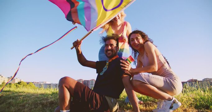 Friends United for Pride: Celebrating Love and Equality waving LGBT Rainbow Flag supporting gay pride month