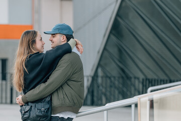 couple of boy and girl on the street outdoors hugging