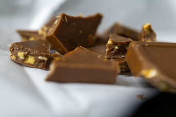 Close-up of chocolate chunks with nuts.