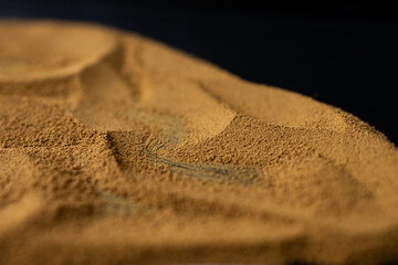 Ground coffee, Ground coffee in the form of mountains on a dark background