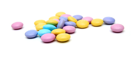 Closeup of colorful chocolate candies on white