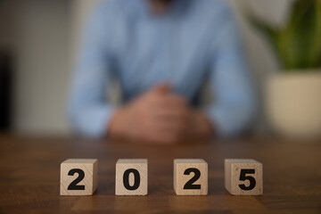2025 on wooden blocks. Business and investment goal ideas.