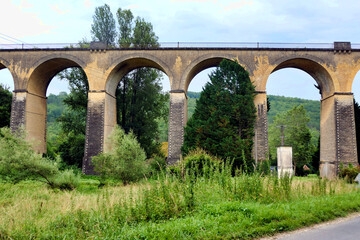 Fototapeta premium 19th century stone built train viaduct crossing the valley at Mauzens et Miremont in the Dordogne, France 19th century stone built train viaduct crossing the valley at Mauzens et Miremont in the Dordo
