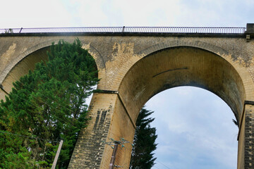 19th century stone built train viaduct crossing the valley at Mauzens et Miremont in the Dordogne,...
