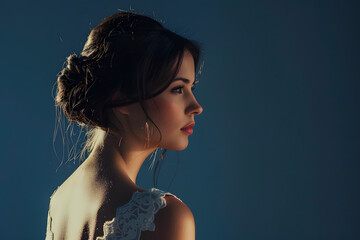 A high-resolution photo of a female model in an elegant evening gown, with a solid dark blue background adding a touch of sophistication 