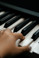 Fototapeta premium Piano keys person plays classical music black and white