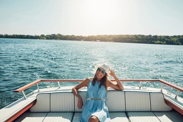 Rolgordijnen zonder boren Adventure, ocean and woman by boat for travel, vacation or holiday with summer in Greece for fun. Smile, tourist and female person with sunglasses and hat relaxing on yacht on sea for weekend trip. © Reese Coop/peopleimages.com