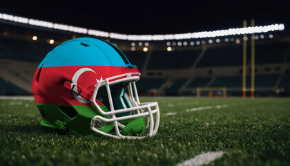 An American football helmet with the Azerbaijan flag design sits on a field at night, under stadium lights