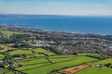 Aerial helicopter views over Swansea, Mumbles and the Gower Peninsular, Wales, UK
