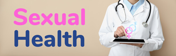 Female doctor with stethoscope using tablet computer on beige background