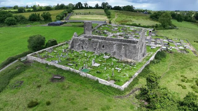 drone footage of Drumlane abbey and round tower in county cavan, ireland