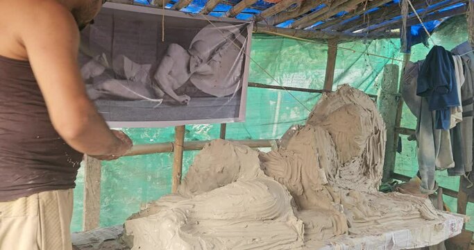 From Clay to Plaster of Paris mold- Indian Sculptor Artist Are crafting Plaster Of Paris Mold of a Dying warrior (fallen Trojan warrior, probably Laomedon) clay Sculpture..
