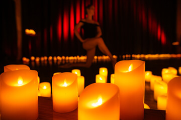 balerina dancing on stage with lots of candles © Ruslan