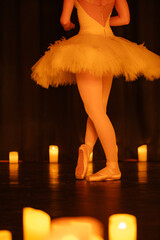 balerina dancing on stage with lots of candles © Ruslan
