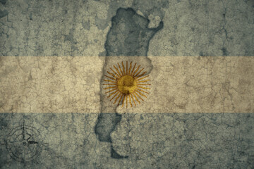 map and flag of argentina on a old vintage crack paper background .